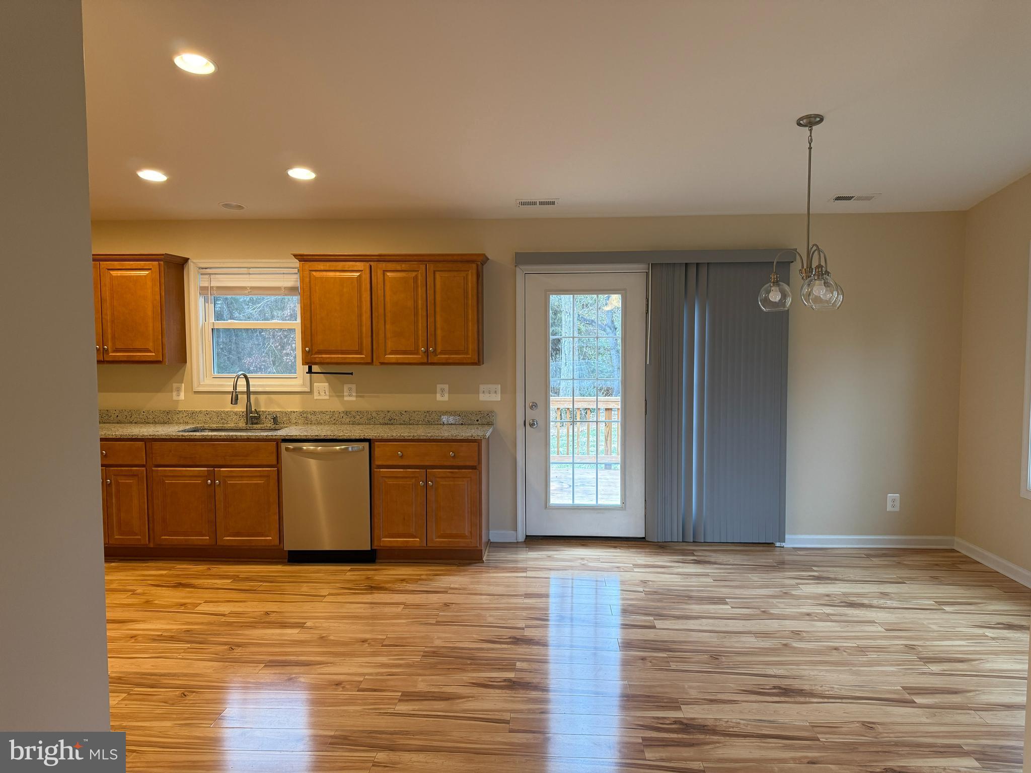 3385 Howellsville Road Front Royal, VA 22630 - Photo 6 of 19 a large kitchen with kitchen island granite countertop a sink window and stainless steel appliances