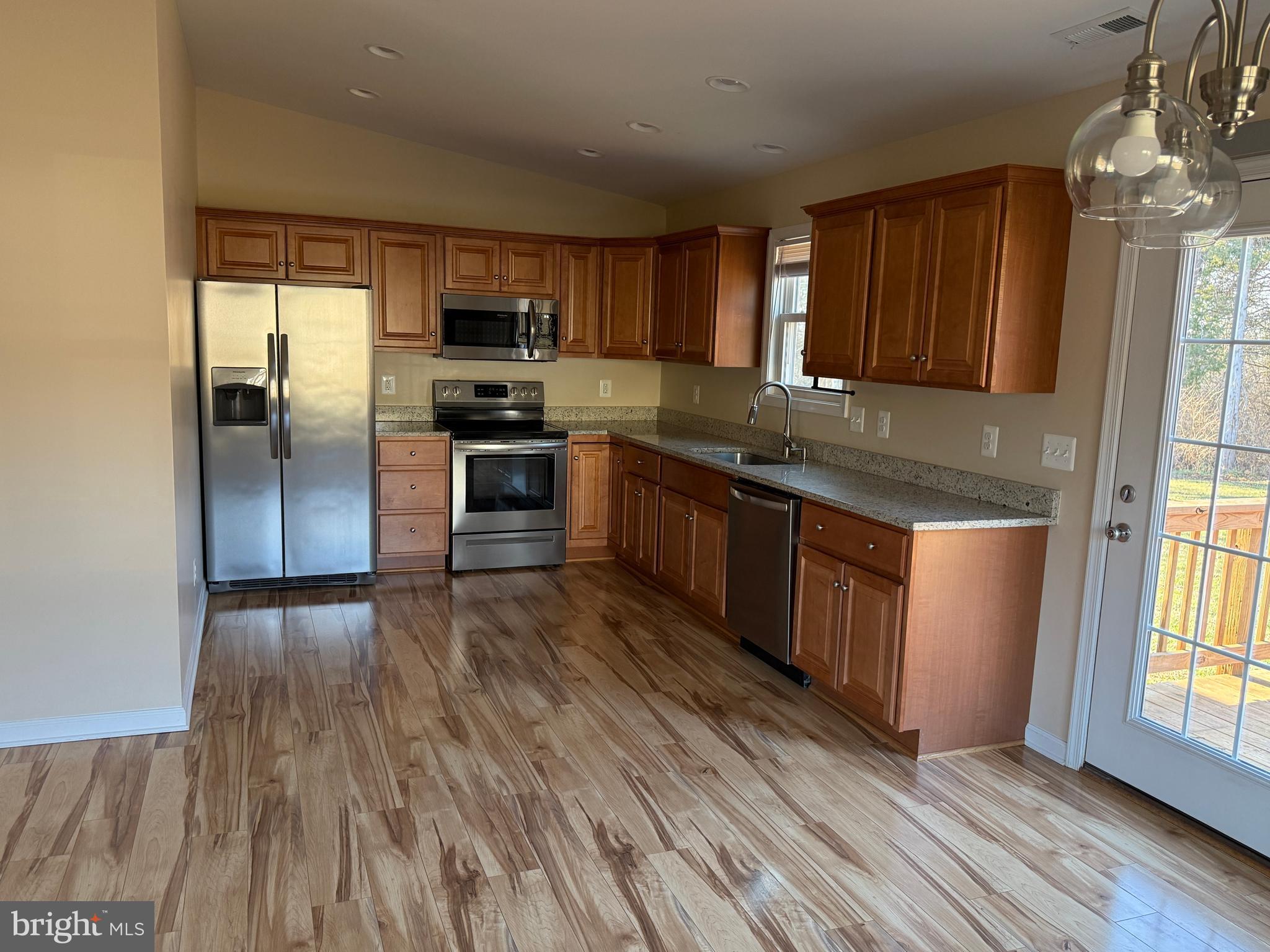 3385 Howellsville Road Front Royal, VA 22630 - Photo 8 of 19 a kitchen with stainless steel appliances granite countertop a stove a sink and a refrigerator