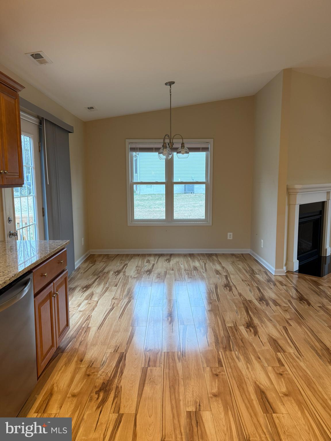 3385 Howellsville Road Front Royal, VA 22630 - Photo 9 of 19 a view of an empty room with wooden floor and a window