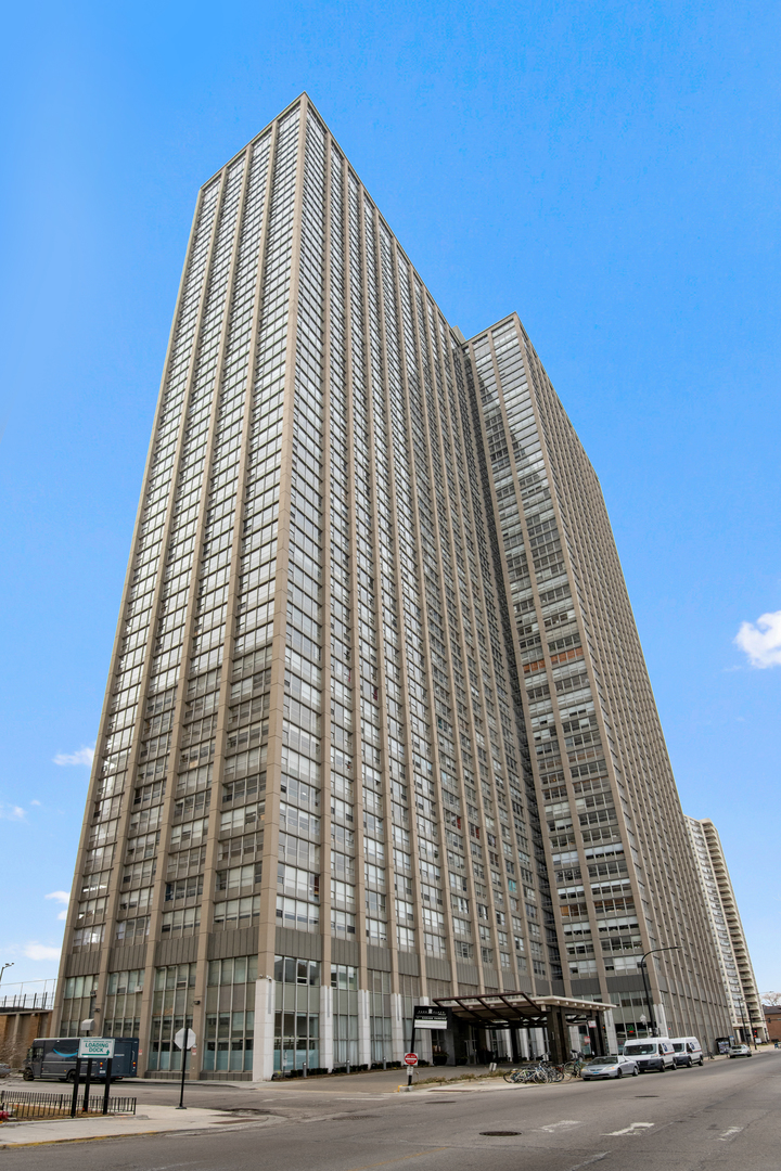 655 West Irving Park Road, Unit 705 Chicago, IL 60613 - Photo 1 of 9 front view of a tall building
