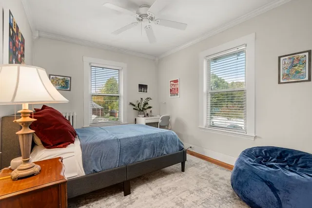 a bedroom with a bed and window