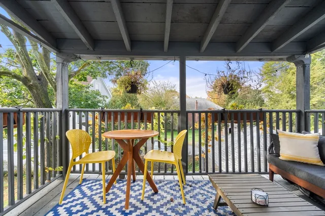 a view of a chair and table in the balcony