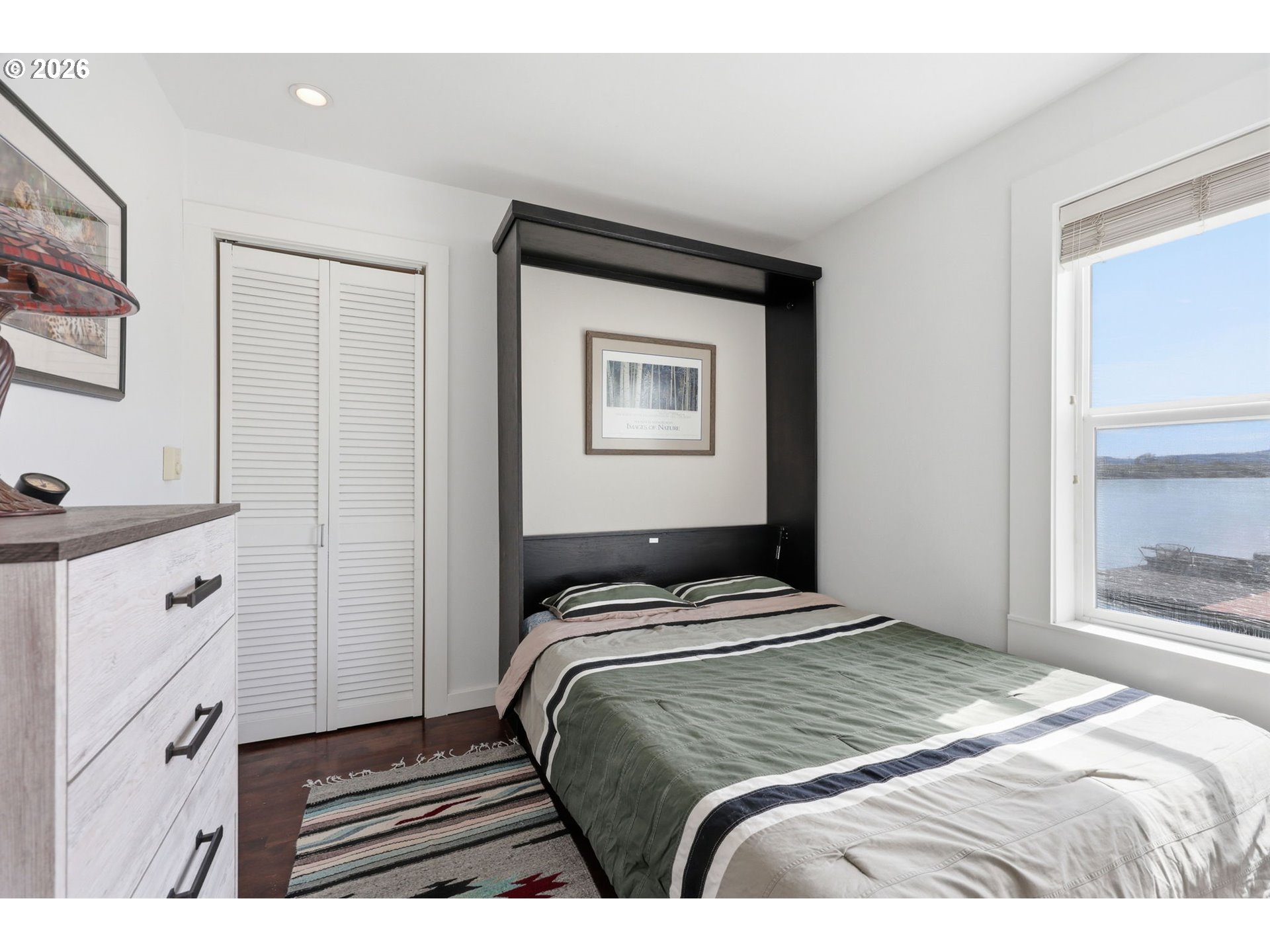34326 Johnson's Landing Road, Unit C27 Scappoose, OR 97056 - Photo 20 of 38 a bedroom with a bed and with cabinets