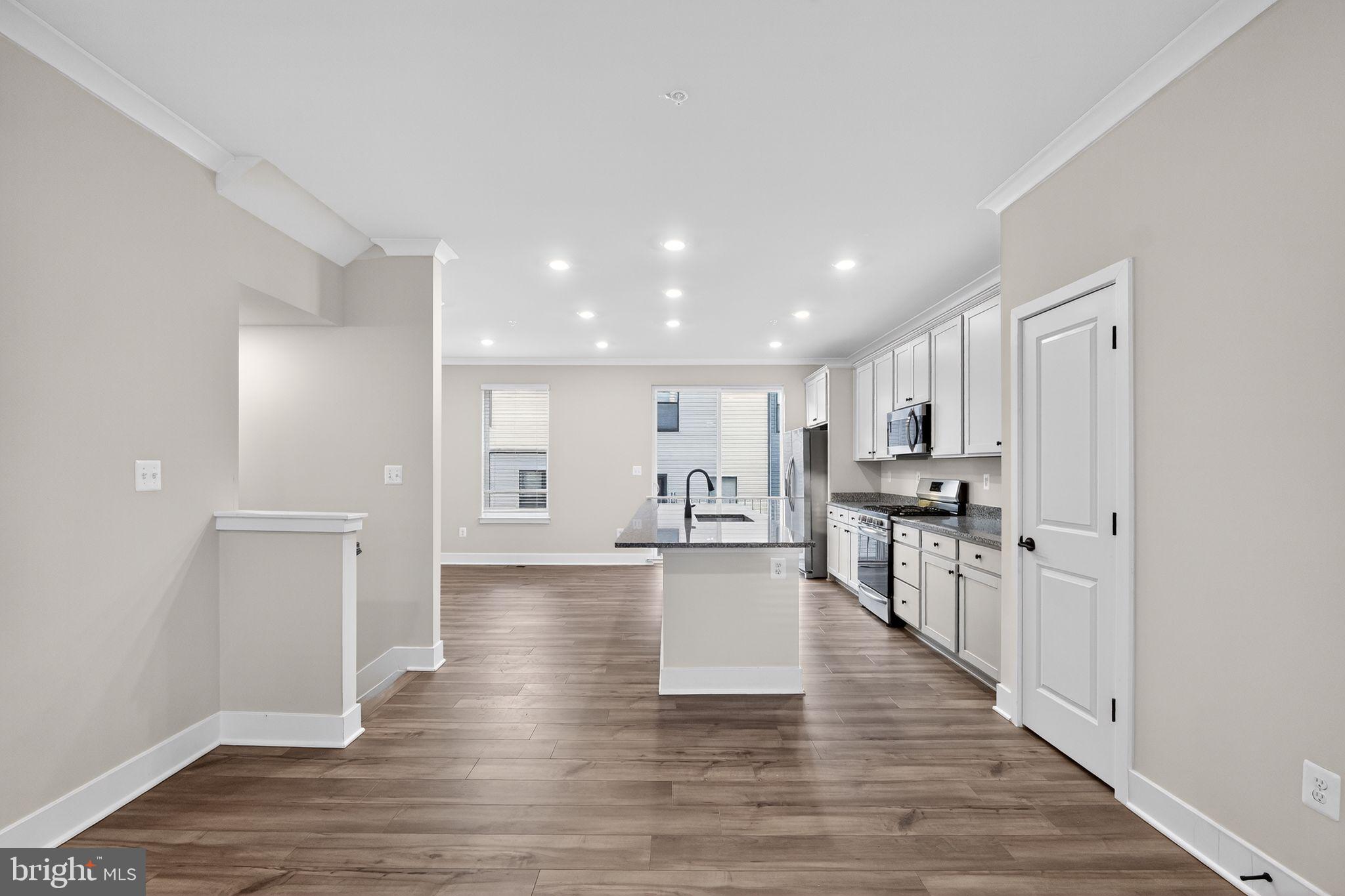 1505 Roland Heights Avenue Baltimore, MD 21211 - Photo 13 of 36 a view of a kitchen with wooden floor