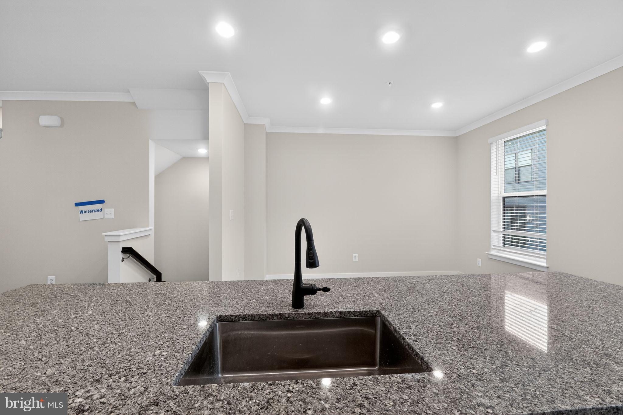 1505 Roland Heights Avenue Baltimore, MD 21211 - Photo 17 of 36 a kitchen with a sink and a window