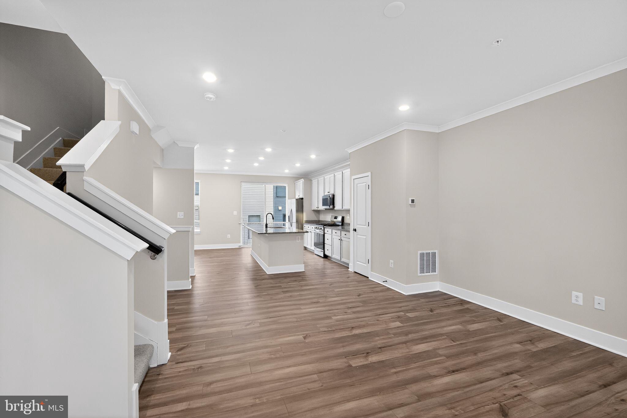 1505 Roland Heights Avenue Baltimore, MD 21211 - Photo 20 of 36 a view of empty room with wooden floor