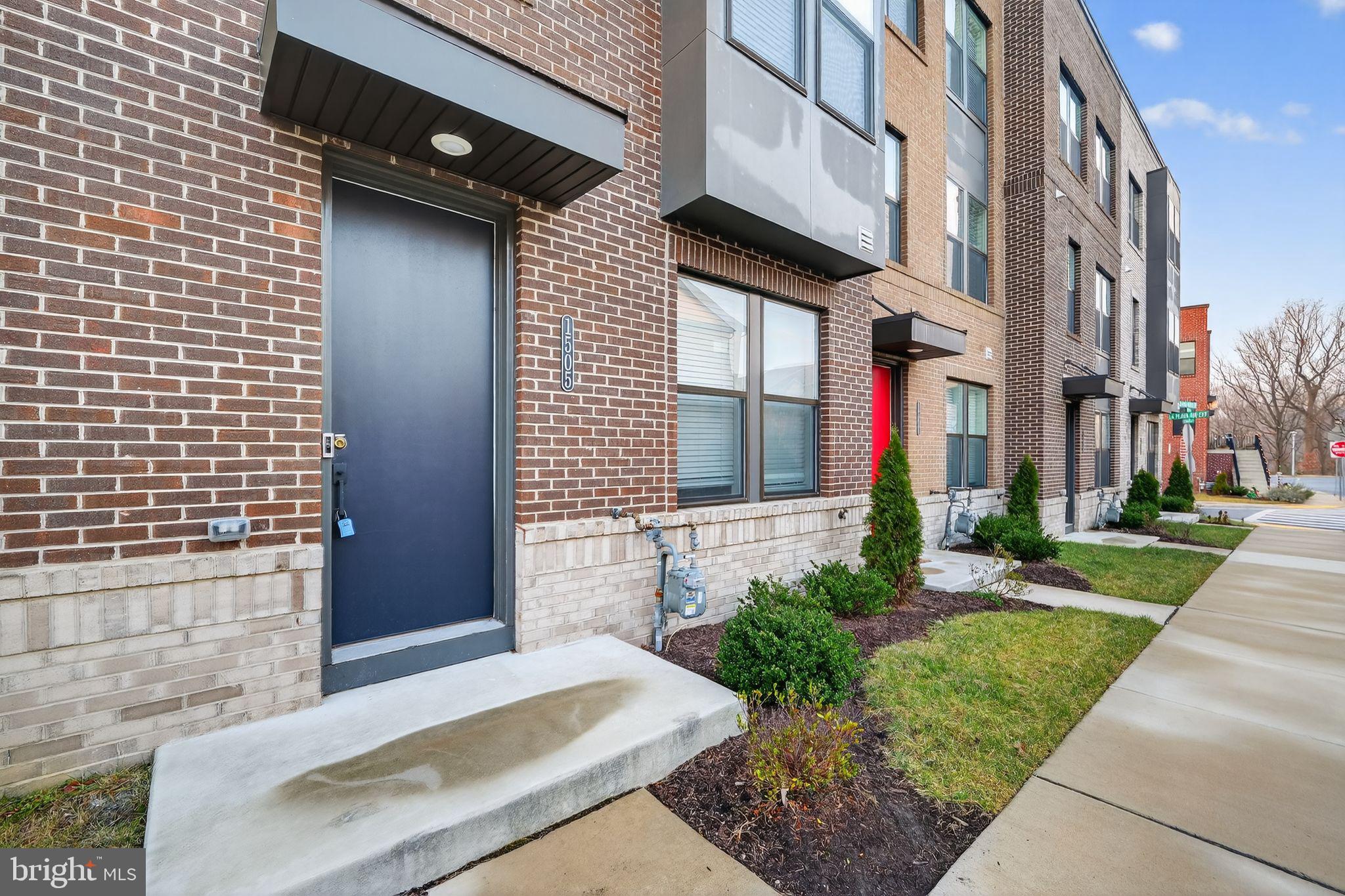 1505 Roland Heights Avenue Baltimore, MD 21211 - Photo 2 of 36 a front view of a house with a yard