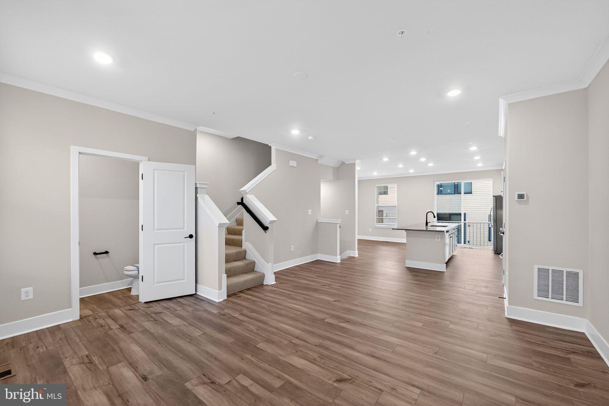 1505 Roland Heights Avenue Baltimore, MD 21211 - Photo 21 of 36 a view of empty room with wooden floor