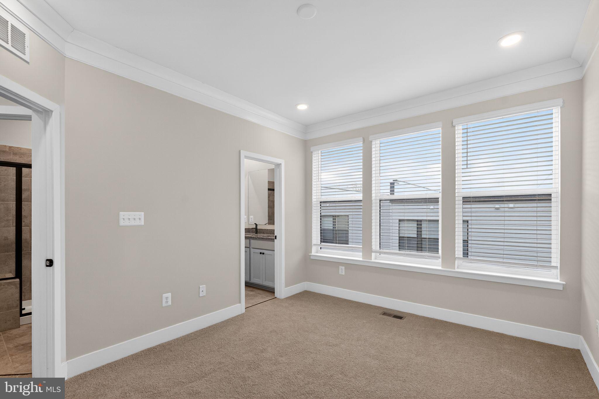 1505 Roland Heights Avenue Baltimore, MD 21211 - Photo 28 of 36 an empty room with windows