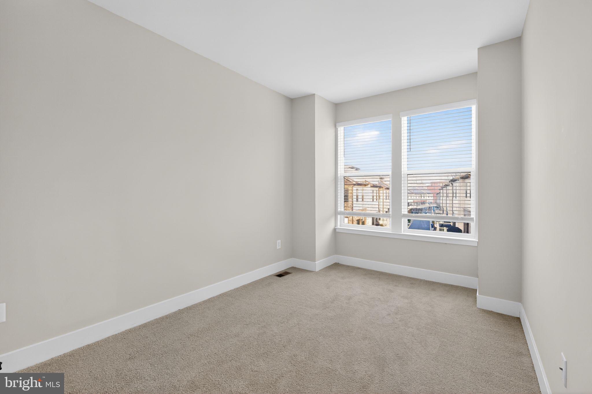 1505 Roland Heights Avenue Baltimore, MD 21211 - Photo 33 of 36 an empty room with windows