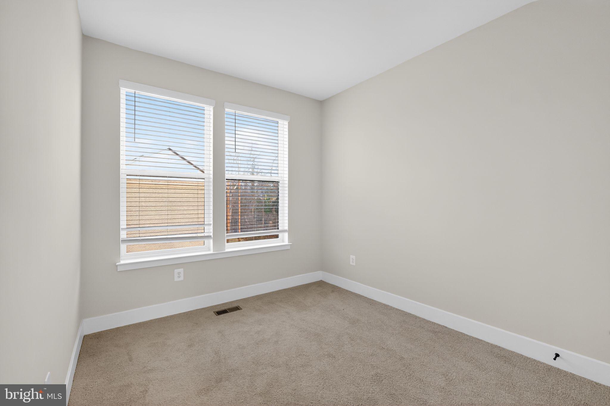 1505 Roland Heights Avenue Baltimore, MD 21211 - Photo 35 of 36 an empty room with a window