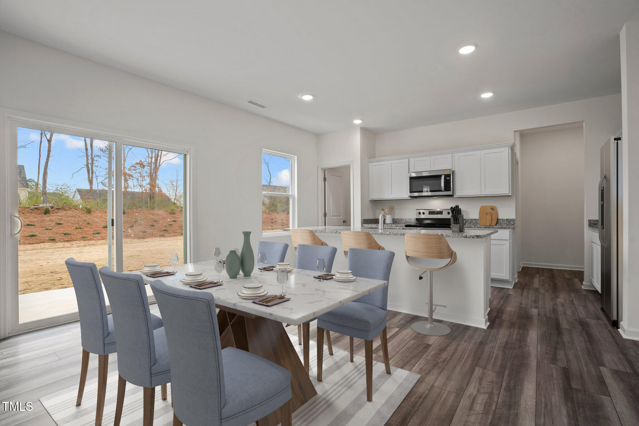 890 Embraer Way Spring Hope, NC 27882 - Photo 8 of 41 a view of a dining room with furniture window and wooden floor
