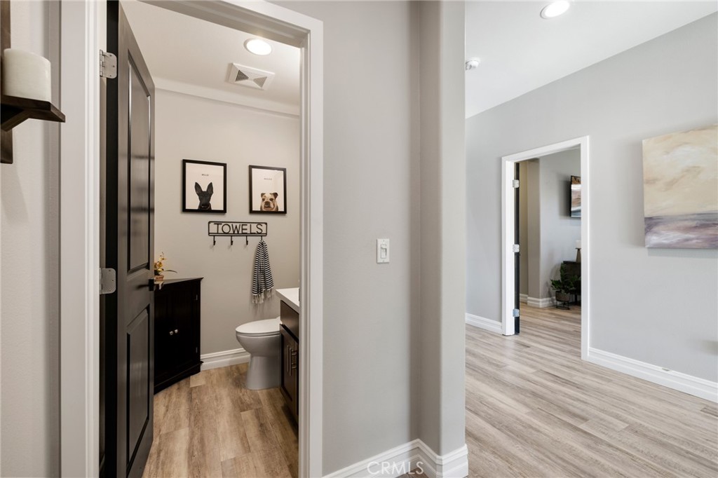 25313 High Noon Court Menifee, CA 92584 - Photo 13 of 73 a view of a bathroom from the hallway