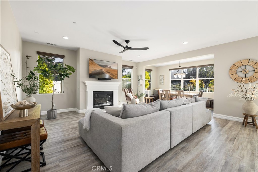 25313 High Noon Court Menifee, CA 92584 - Photo 15 of 73 a living room with furniture fireplace and a large window