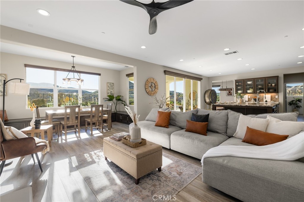 25313 High Noon Court Menifee, CA 92584 - Photo 16 of 73 a living room with furniture and a large window