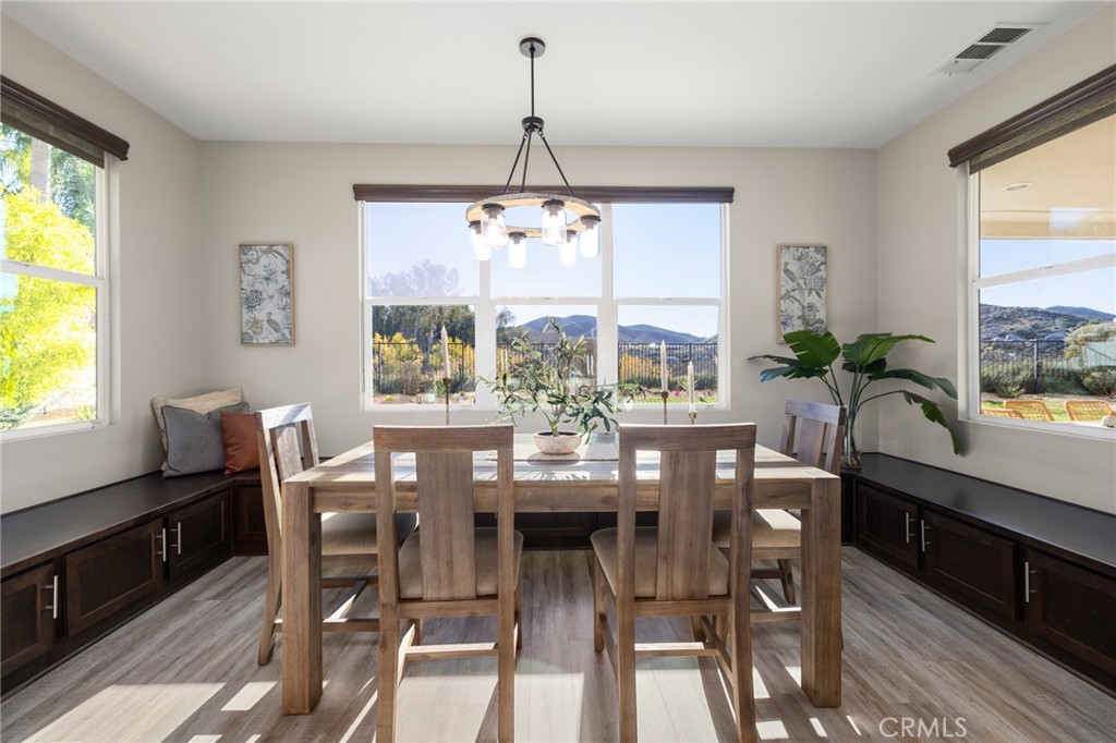 25313 High Noon Court Menifee, CA 92584 - Photo 19 of 73 a view of a dining room with furniture window and outside view