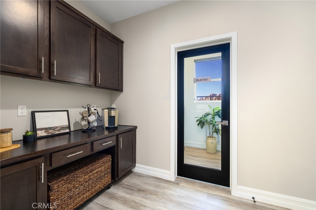 25313 High Noon Court Menifee, CA 92584 - Photo 25 of 73 a kitchen with stainless steel appliances granite countertop a refrigerator and a stove top oven