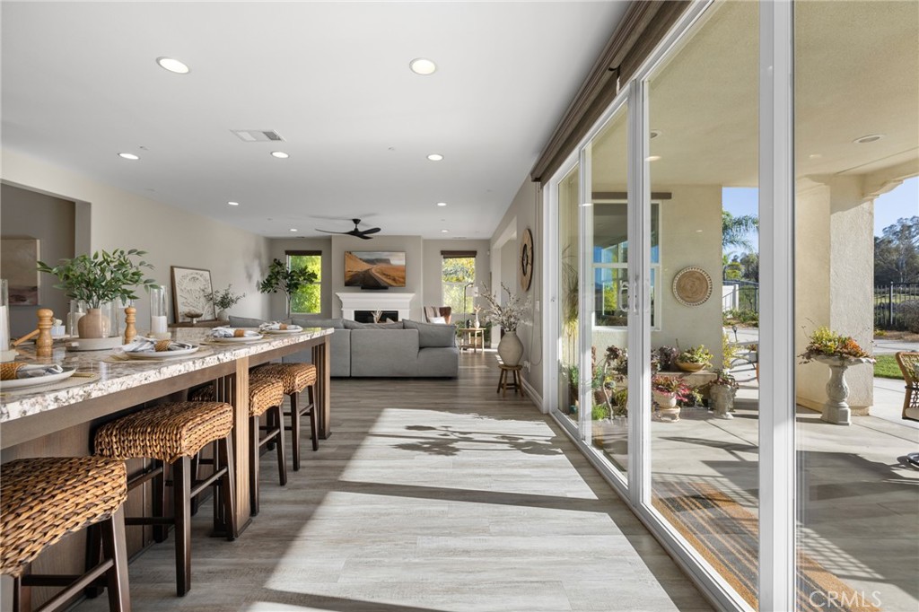 25313 High Noon Court Menifee, CA 92584 - Photo 32 of 73 a kitchen with stainless steel appliances granite countertop lots of counter top space and furniture