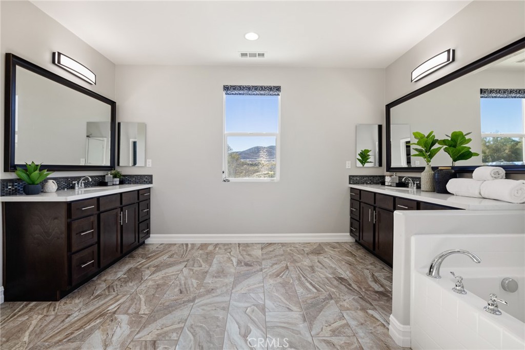 25313 High Noon Court Menifee, CA 92584 - Photo 49 of 73 a bedroom with a bed and a dresser