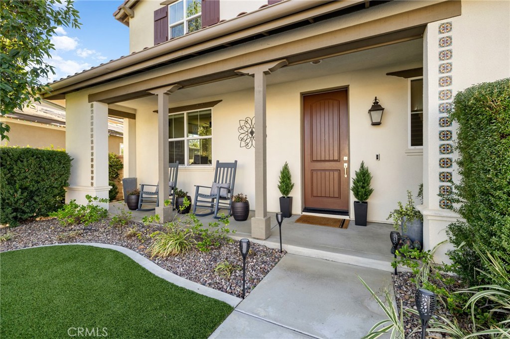 25313 High Noon Court Menifee, CA 92584 - Photo 5 of 73 a front view of a house with garden