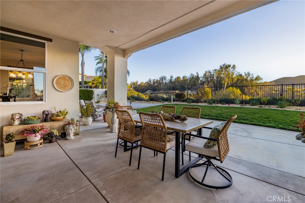 25313 High Noon Court Menifee, CA 92584 - Photo 53 of 73 a view of a patio with a table and chairs