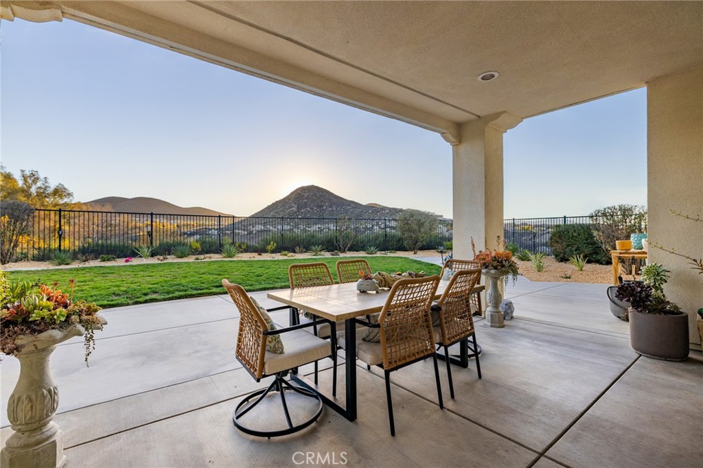 25313 High Noon Court Menifee, CA 92584 - Photo 54 of 73 a view of a patio with chairs and table in a patio