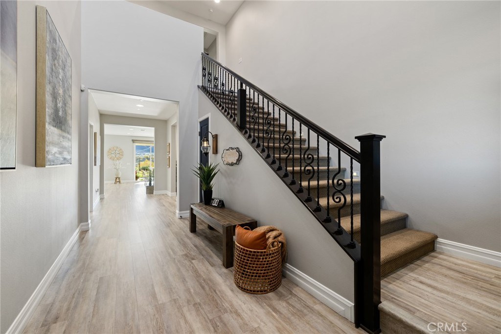 25313 High Noon Court Menifee, CA 92584 - Photo 6 of 73 a view of entryway and hall with wooden floor