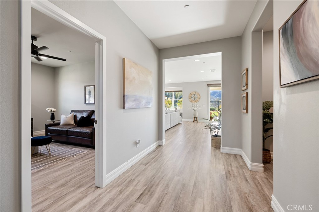 25313 High Noon Court Menifee, CA 92584 - Photo 7 of 73 a living room with furniture and a wooden floor