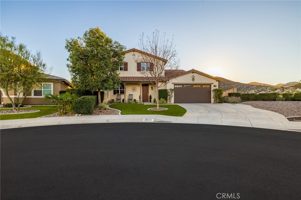 25313 High Noon Court Menifee, CA 92584 - Photo 73 of 73 a front view of a house with a garden and yard