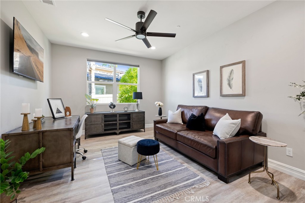 25313 High Noon Court Menifee, CA 92584 - Photo 8 of 73 a living room with furniture flat screen tv and a large window