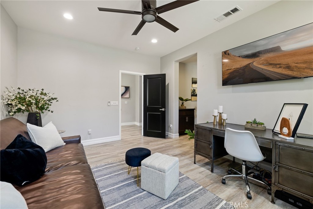 25313 High Noon Court Menifee, CA 92584 - Photo 10 of 73 a living room with furniture and a flat screen tv