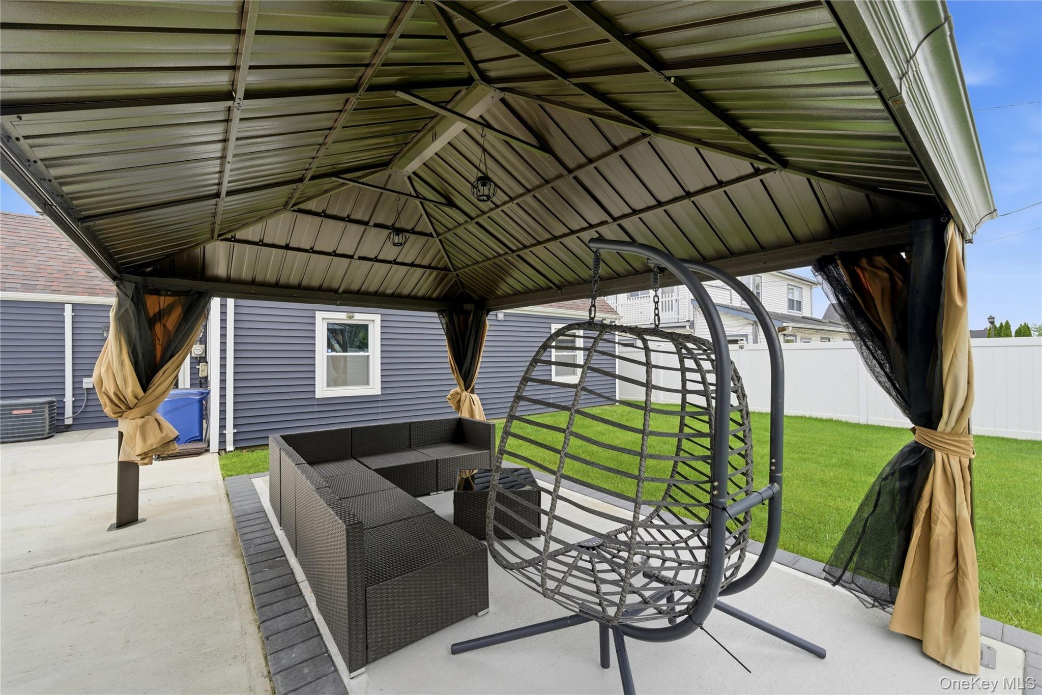 50 Ridge Lane Levittown, NY 11756 - Photo 24 of 27 a view of a couches in the patio