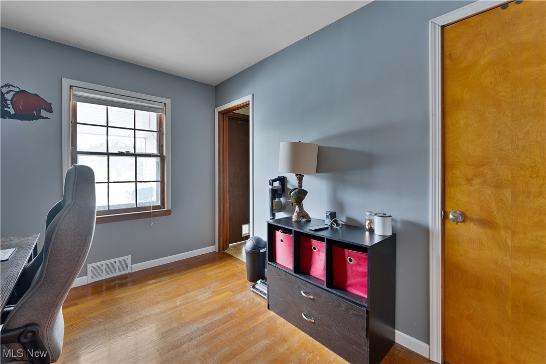 2702 Brunswick Road Youngstown, OH 44511 - Photo 13 of 18 Home office featuring light wood-type flooring, visible vents, and baseboards