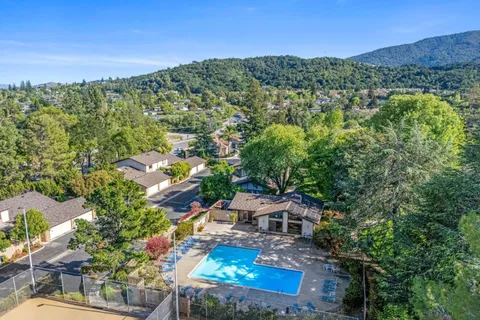an aerial view of residential house and sandy dunes