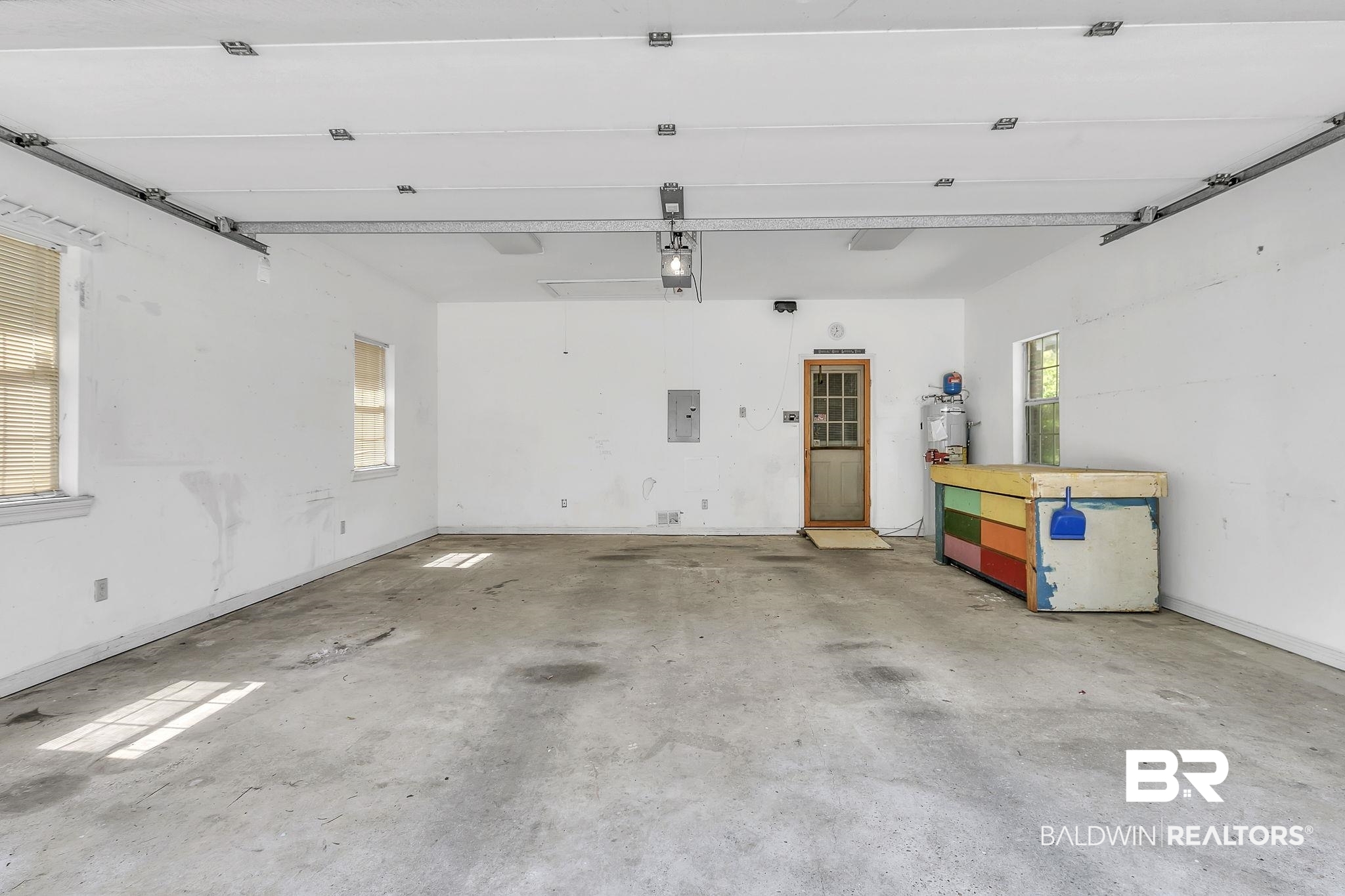 367 Ridgewood Drive Daphne, AL 36526 - Photo 48 of 71 Garage with electric panel, a garage door opener, and water heater