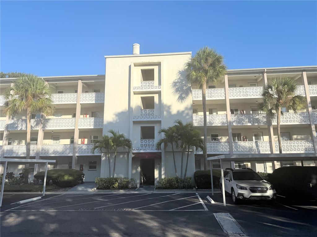 1524 Lakeview Road, Unit 305 Clearwater, FL 33756 - Photo 1 of 18 a front view of a building with street view
