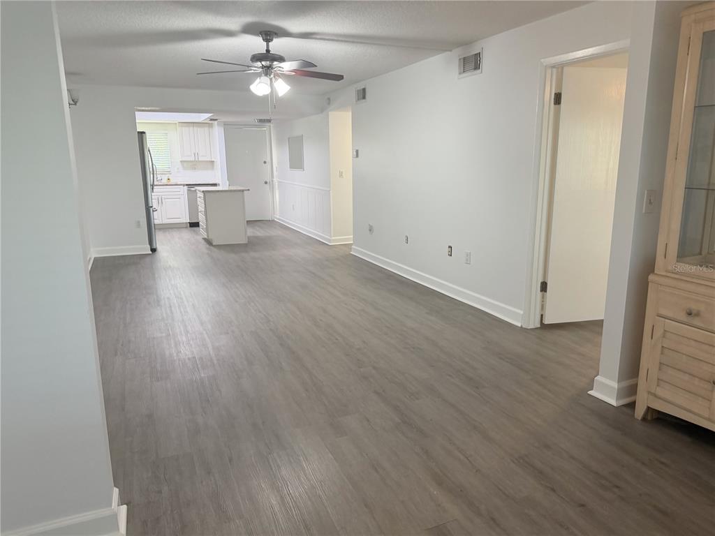 1524 Lakeview Road, Unit 305 Clearwater, FL 33756 - Photo 8 of 18 wooden floor in an empty room with a window