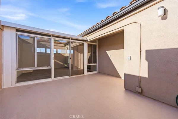 a view of an empty room with a balcony