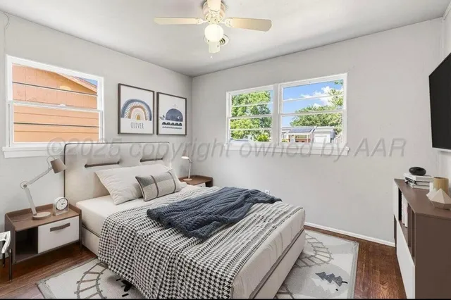 a bedroom with bed and a window