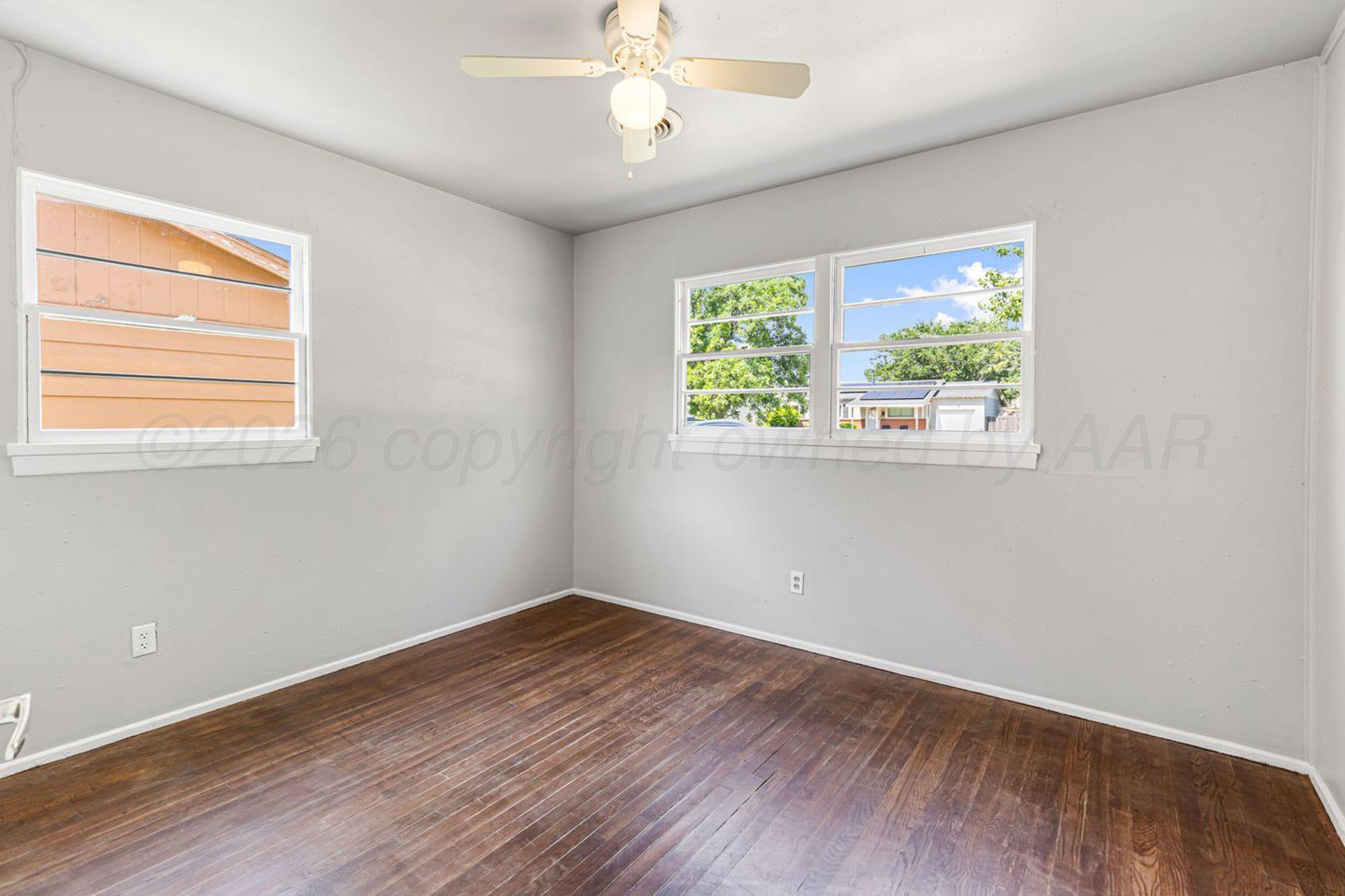 2905 South Roosevelt Street Amarillo, TX 79103 - Photo 15 of 21 a view of a room with wooden floor and windows
