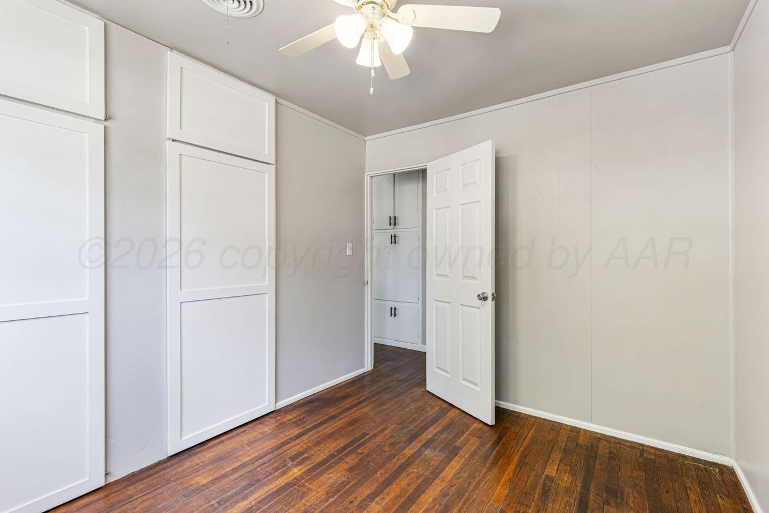 2905 South Roosevelt Street Amarillo, TX 79103 - Photo 20 of 21 a view of an empty room with wooden floor