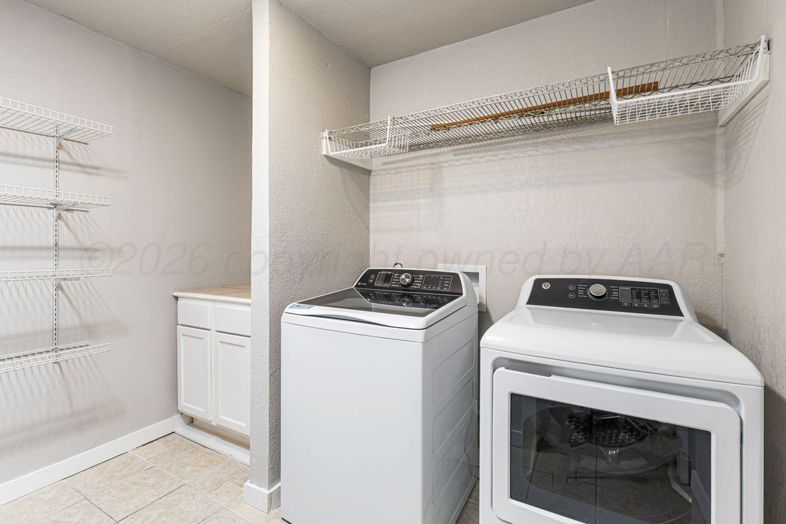 2905 South Roosevelt Street Amarillo, TX 79103 - Photo 6 of 21 a utility room with dryer and washer