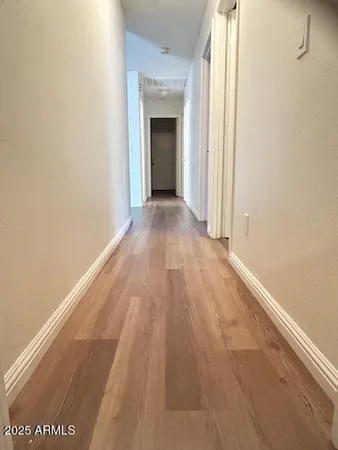 a bathroom with a toilet a sink and a mirror