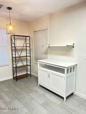 a kitchen with a stove and a table
