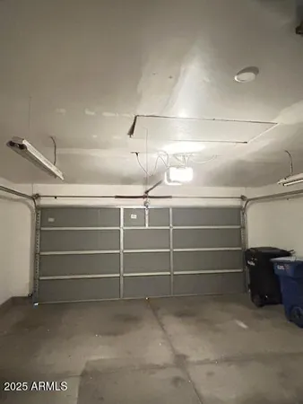 a room with a refrigerator and washer