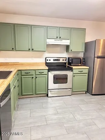 a kitchen with a stove and a sink