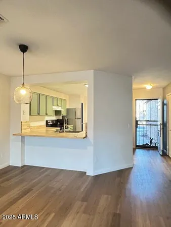 a view of a livingroom with furniture wooden floor
