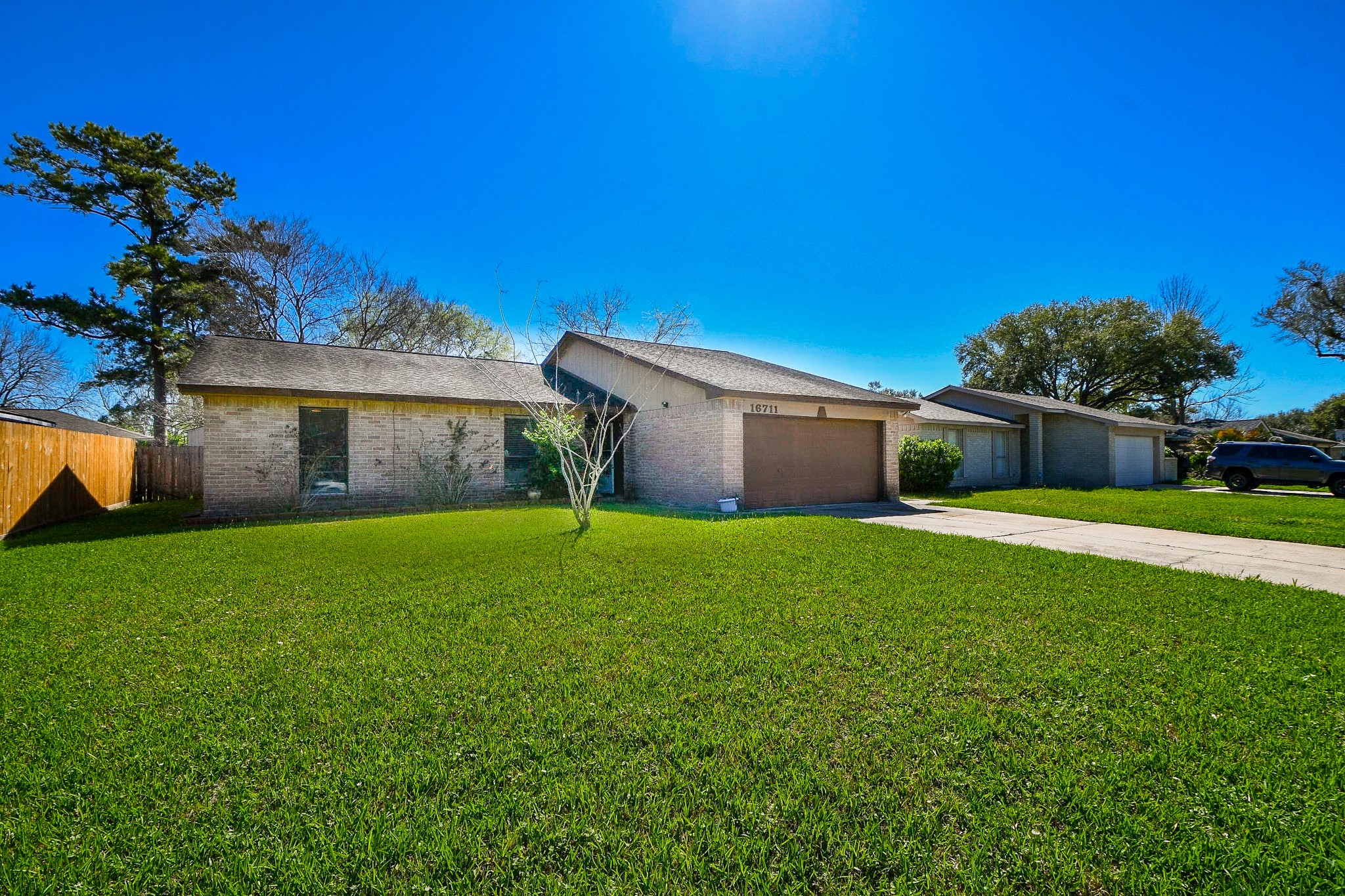 16711 Ribbonridge Drive Sugar Land, TX 77498 - Photo 3 of 24 a front view of a house with garden