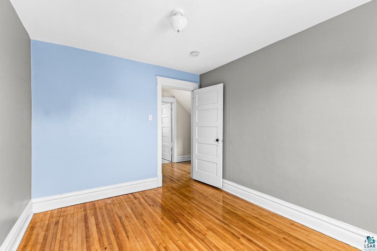 607 3rd Avenue East Superior, WI 54880 - Photo 20 of 41 Empty room featuring light wood-type flooring and baseboards