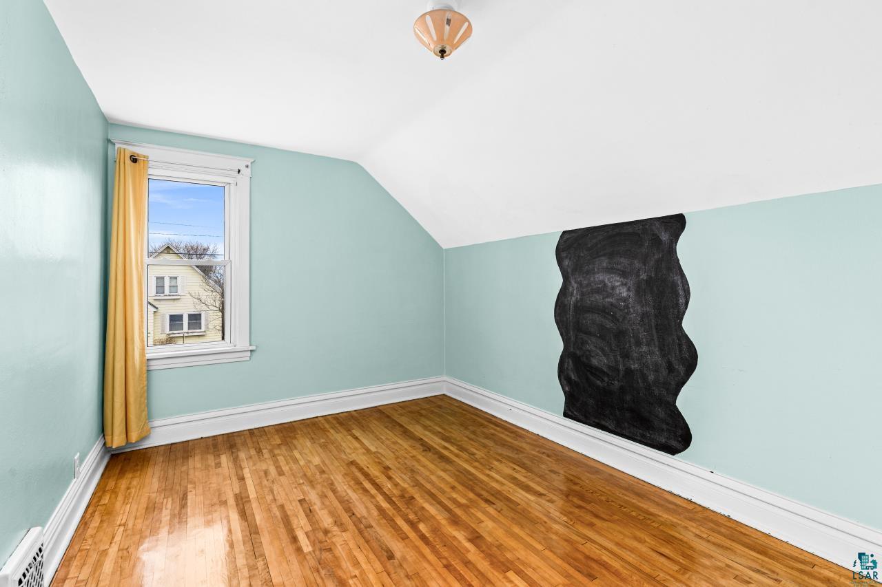 607 3rd Avenue East Superior, WI 54880 - Photo 25 of 41 Bonus room with vaulted ceiling and light wood-type flooring